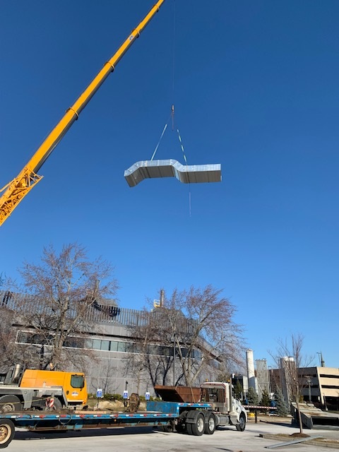 Duct work being lifted into place - MTECHNE Mechanical Services Contractor Wilmington, MA 01887